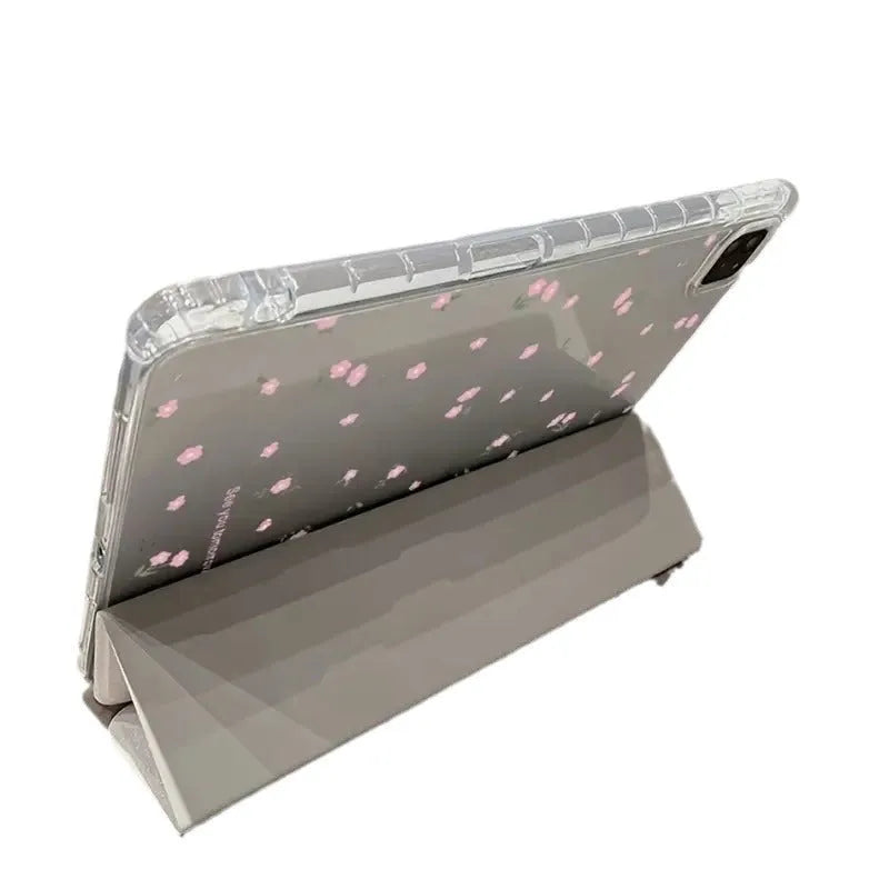Transparent floral patterned iPad case folded into standing position showing magnetic closure and port cutouts