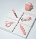 Baby nail clippers with silicone finger grips, stainless steel blades, and a choice of blue or pink animal designs.