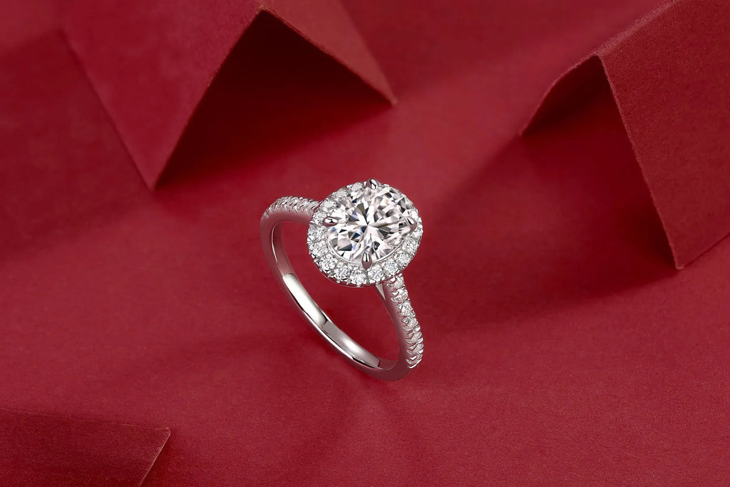 Audrey moissanite wedding ring set with egg-shaped 7x9mm stone in S925 silver platinum plating on white background