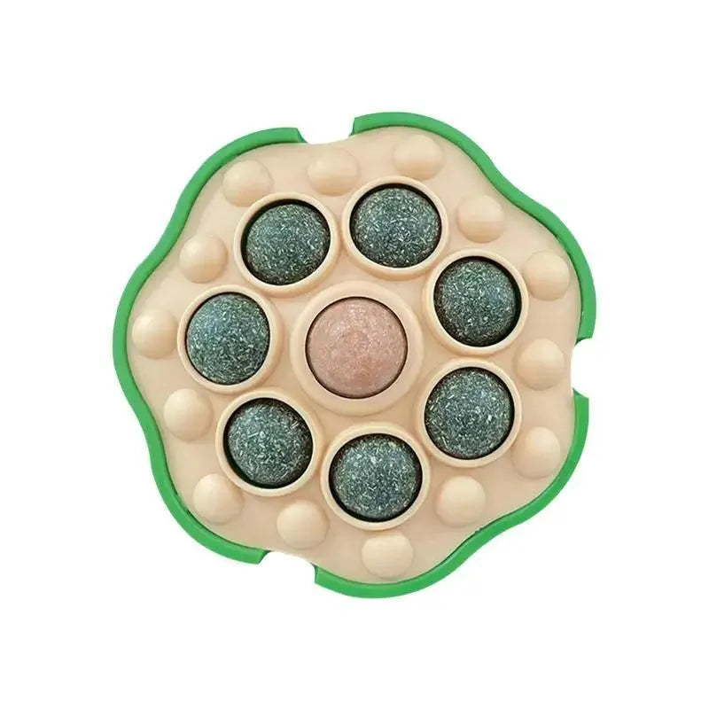 Green wall-sticking catnip ball with edible filling for indoor feline play and dental care