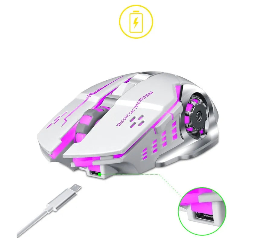 Black and white silent wireless computer mouse on a desk next to a laptop.