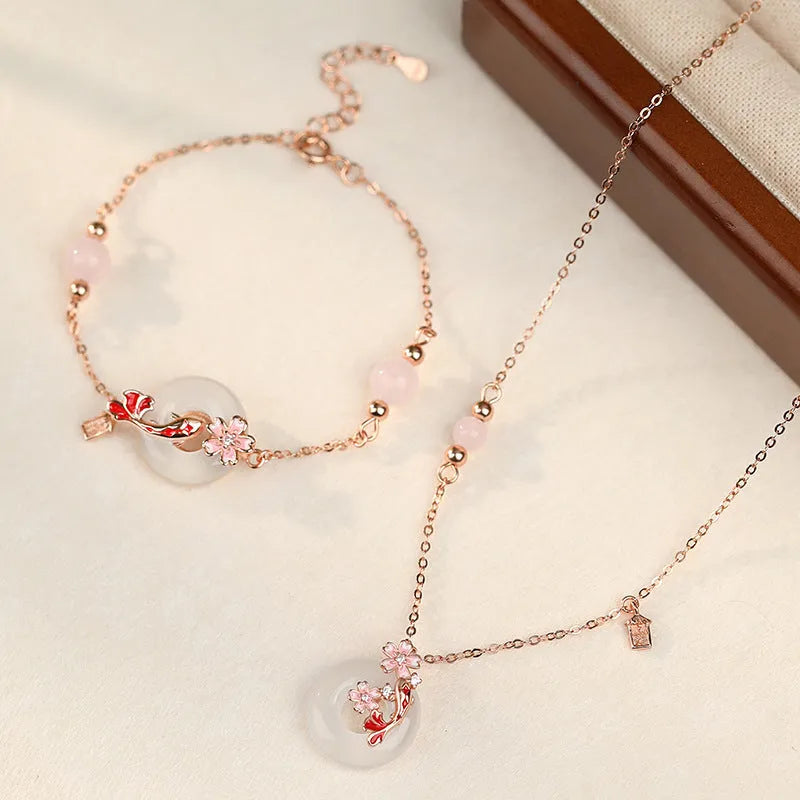 Close-up of a women's S925 sterling silver bracelet with a white chalcedony crystal flower and koi-themed design.