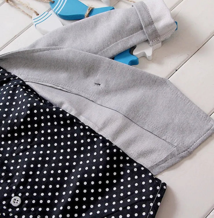 Kids blue cotton blend sport suit set with zip jacket and elasticated waist trousers on a hanger.