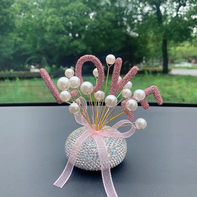 Clay star car decoration ornament for centre console in various red, pink, and pearl white colour designs.