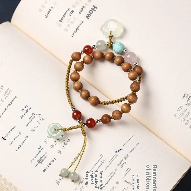 Hand-woven ebony double ring bracelet with traditional jade beads and Ruyi charm elements