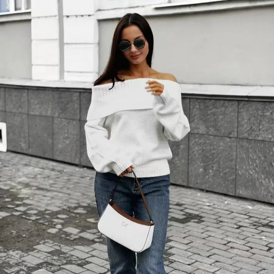 Grey off-the-shoulder sweater with a 3D pattern and strapless design on a model.