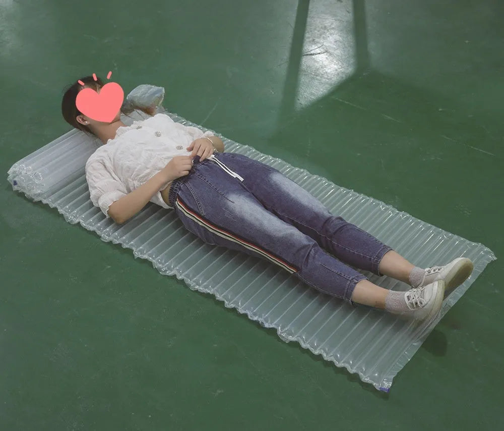 Transparent outdoor airbed showing dimensions of 200 cm length, 60 cm width, and 5 cm thickness