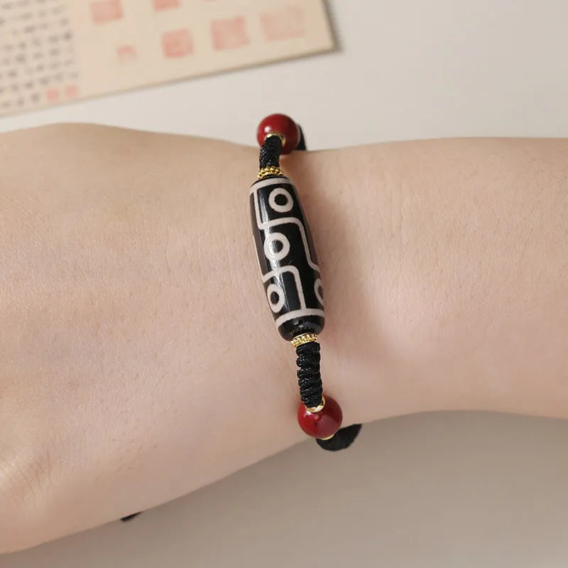 Men's Tibetan agate Dzi bead bracelet with shrinkable adjustable closure showing traditional couple style beadwork