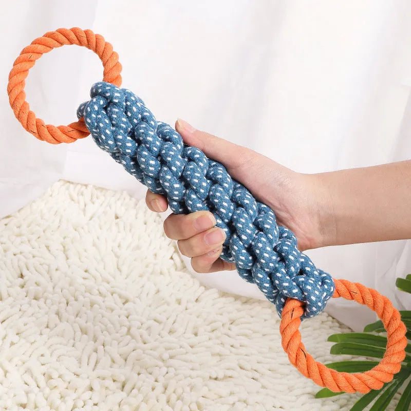 Blue braided cotton rope dog toy shaped like a bone with two rings, on a white background.