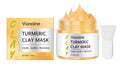 Yellow turmeric mud mask in a tub with an application brush.