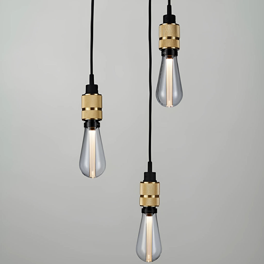 Components of a DIY retro ceiling light assembly kit in chrome finish, showing metal ceiling rose, braided cord, and lamp holder.