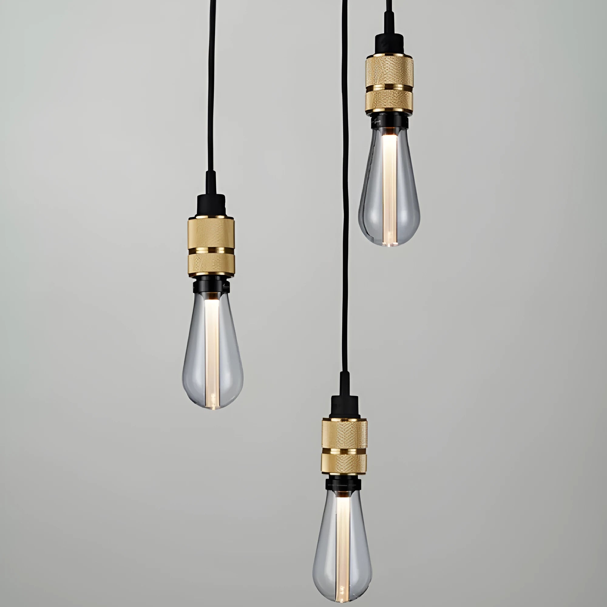 Components of a DIY retro ceiling light assembly kit in chrome finish, showing metal ceiling rose, braided cord, and lamp holder.