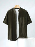 Men's loose-fit short-sleeve linen shirt in a solid colour with a stand collar.
