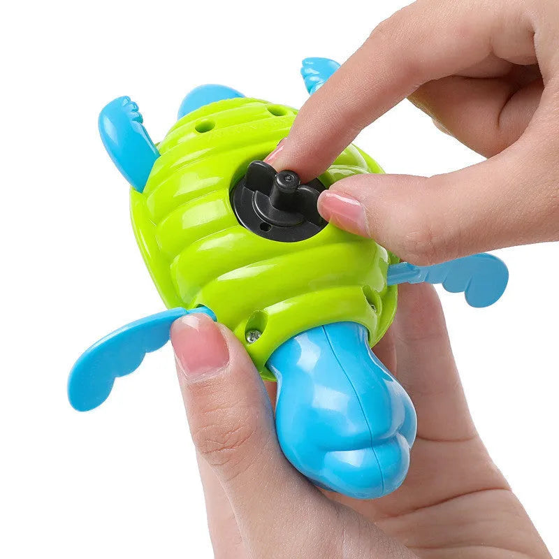 Plastic swimming turtle bath toy with brain game element for water play