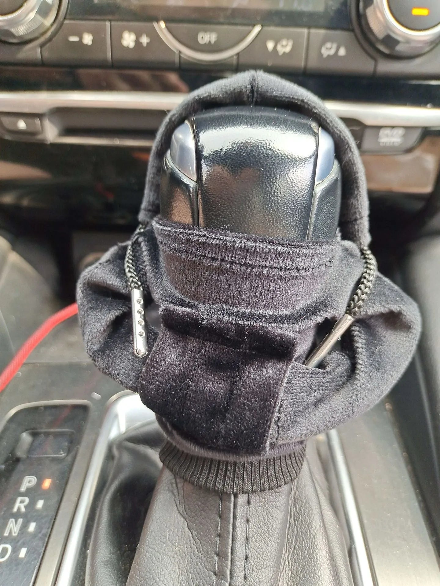 Pure cotton car gear lever decoration in assorted colours on a gear stick.