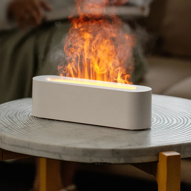 White square DQ709 flame aroma diffuser humidifier with glowing orange flame effect and water mist.