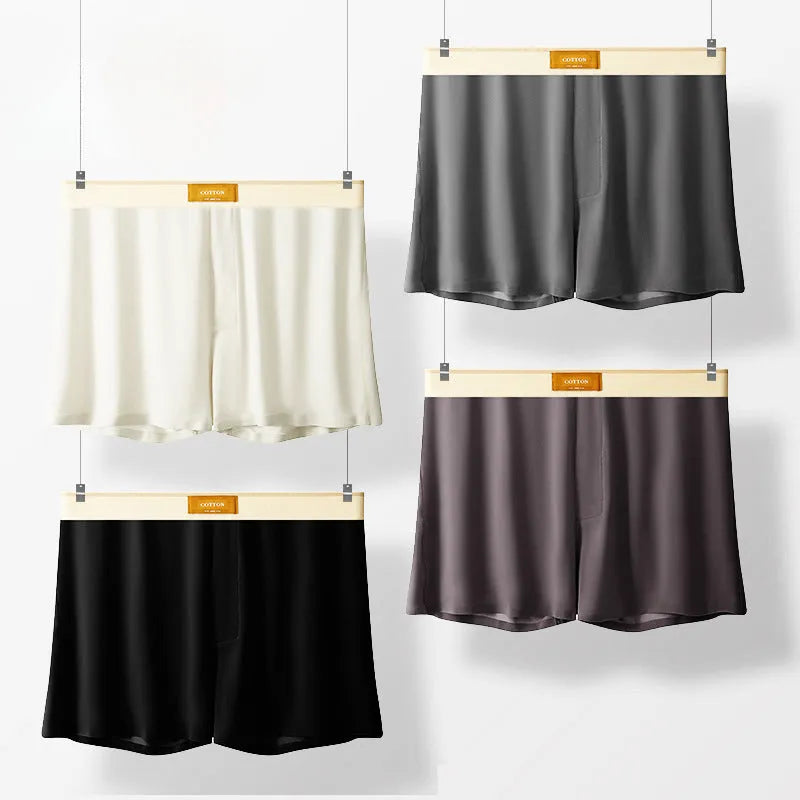 Pack of three men's solid colour loose fit ice silk nylon underwear on a mid waist mannequin.