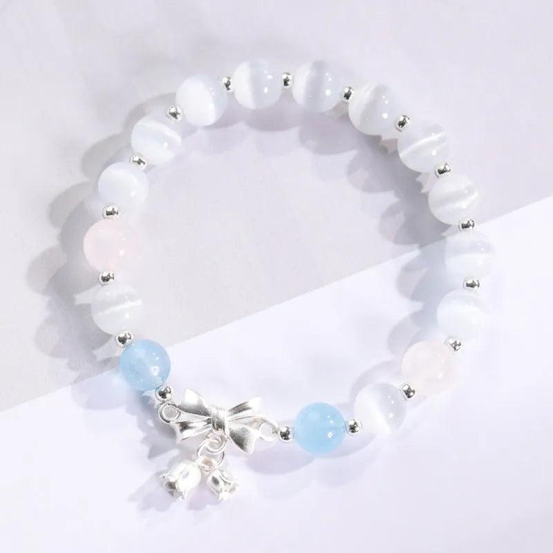 Close-up of electroplated opal cat's eye beaded bracelet for women with diamond-shaped charm