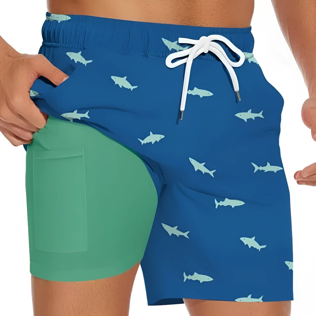 Men's black beach shorts with a shark graphic and a white drawstring waist
