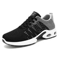 Men's black and grey Flyknit mesh sneakers with soft sole and lace-up design