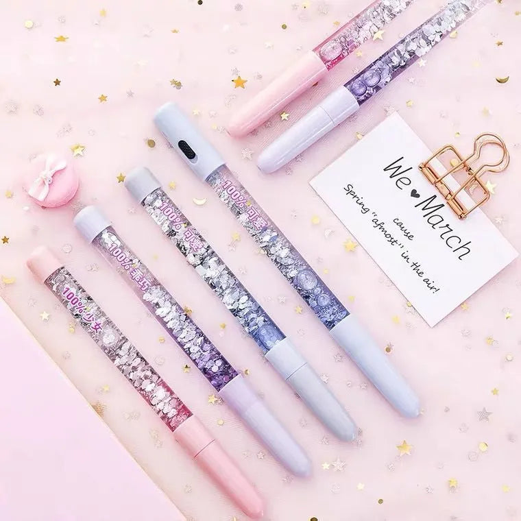 Luminous glitter quicksand neutral pen with 0.5mm fine tip in fairy wand blue colour showing flowing glitter inside clear plastic barrel