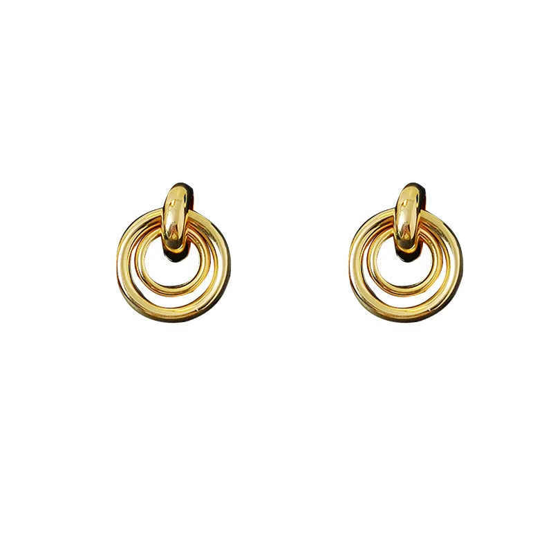 Geometric round ring earrings with irregular styling in gold and silver colour options