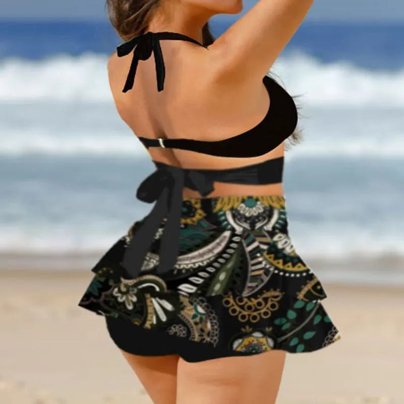 Purple women's bikini set with lace-up detail and matching high-waisted skirt.