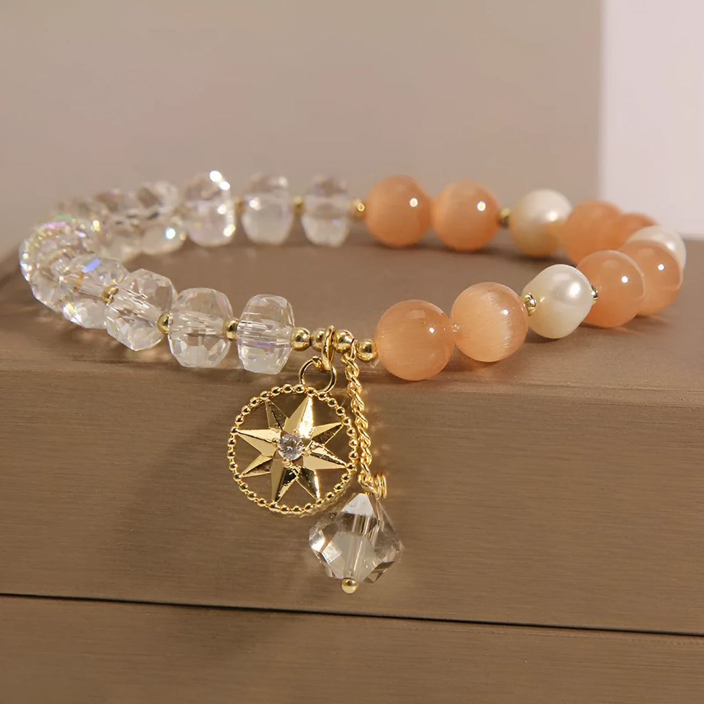 Orange Eight Awn Star bracelet with gold-plated setting and opal crystal inlay
