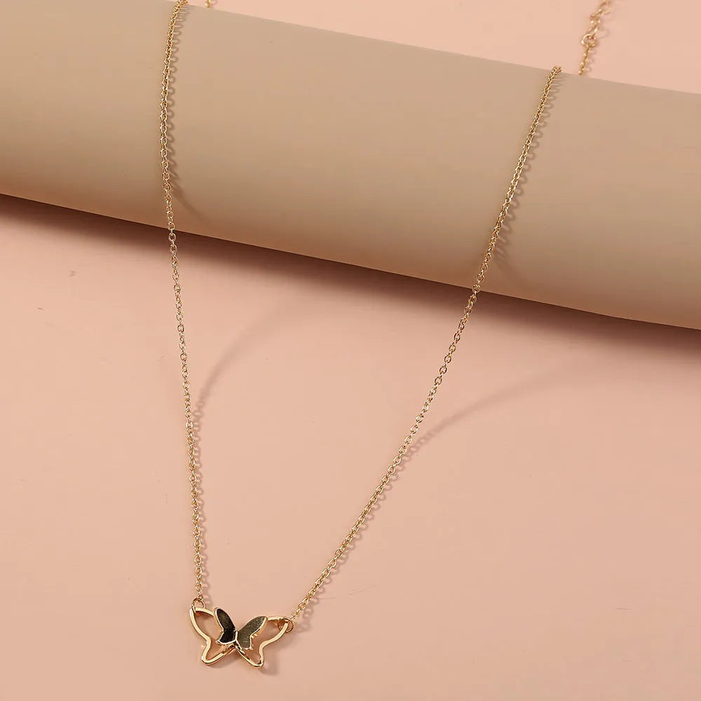 Women's double-layer copper alloy bow pendant necklace on adjustable cross chain