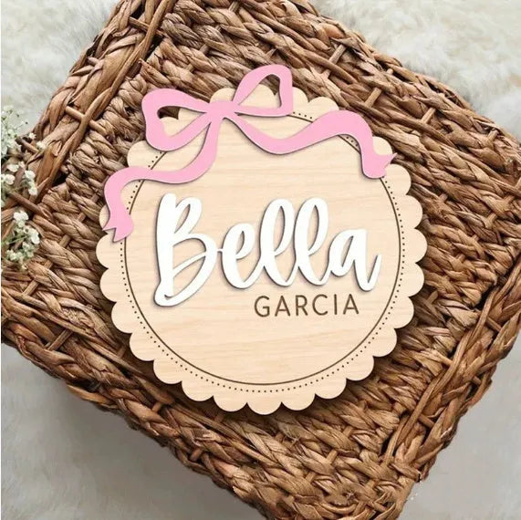 Square wooden baby room ornament with customised name engraving for nursery decor.