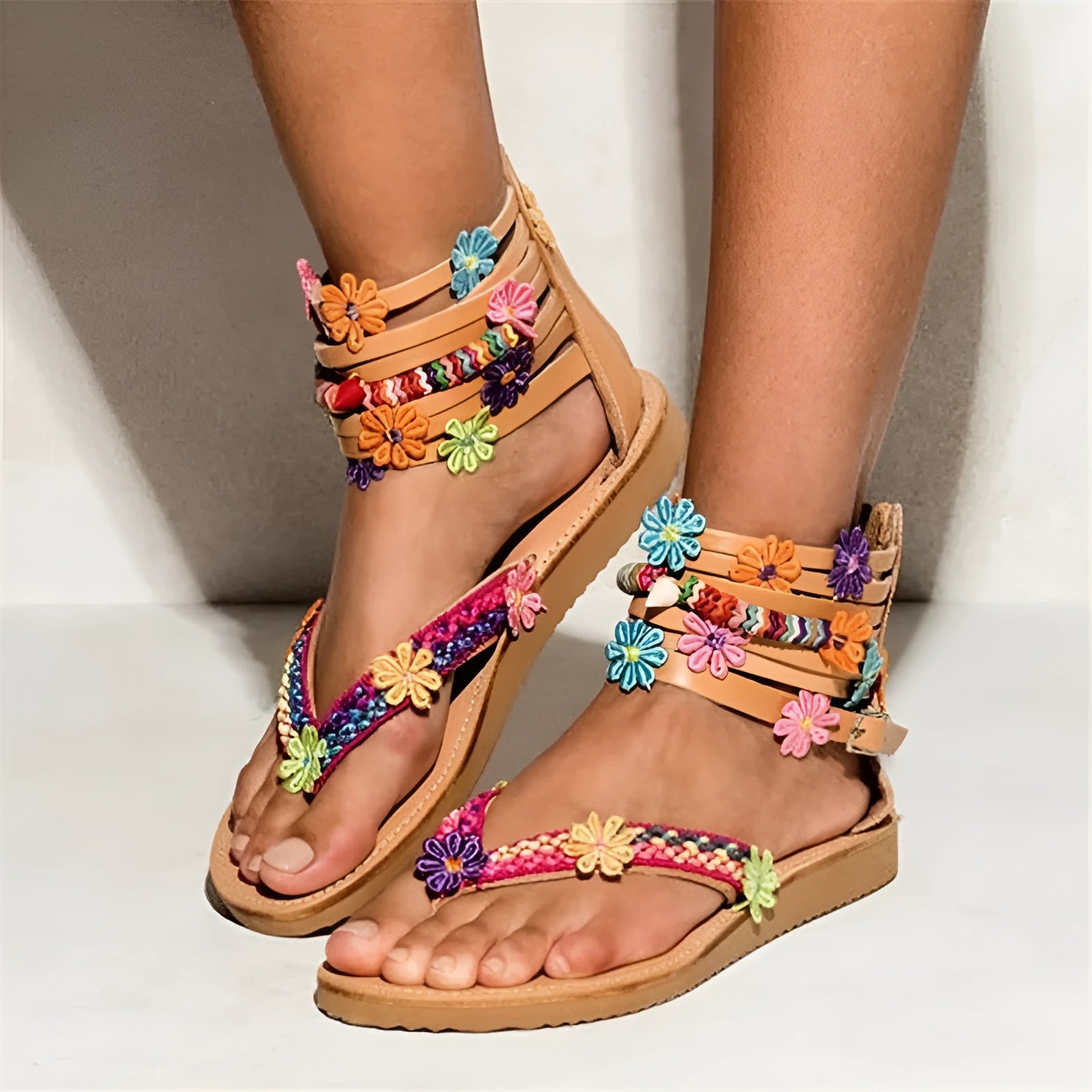 Women's ethnic beaded petal Roman sandals with floral decoration on artificial PU upper.