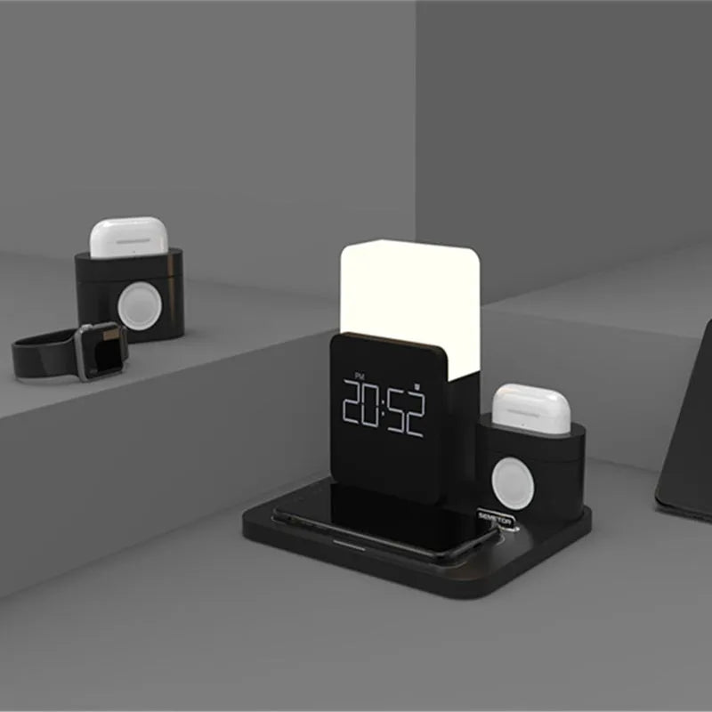 Dark green wireless charging stand holding a mobile phone and a pair of headphones.