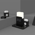 Dark green wireless charging stand holding a mobile phone and a pair of headphones.