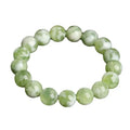 Green milk-in-water Xiuyan jade bracelet with polished finish and geometric unisex styling