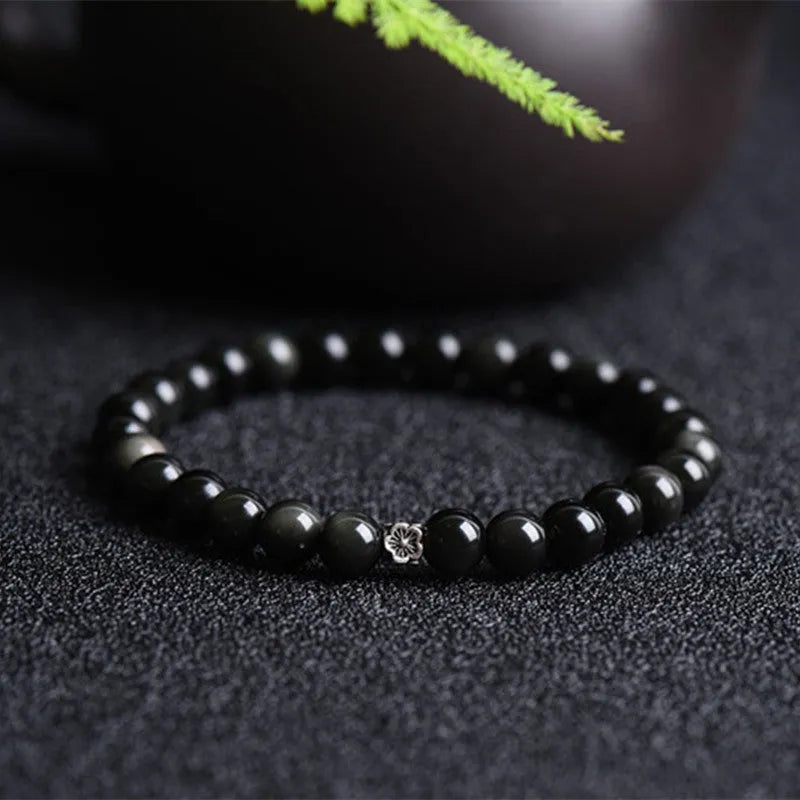 Natural obsidian bracelet with S925 silver flower accessories showing 6mm stone beads
