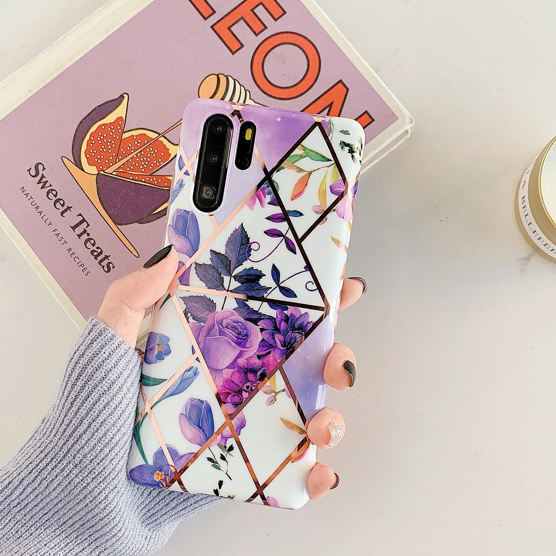 Huawei phone back cover with white floral lattice pattern on a dark background