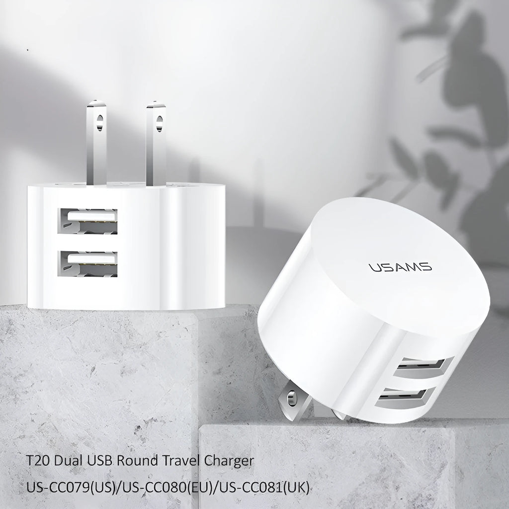 White portable universal dual USB phone charger with foldable US, EU, and UK plugs showing 39mm diameter