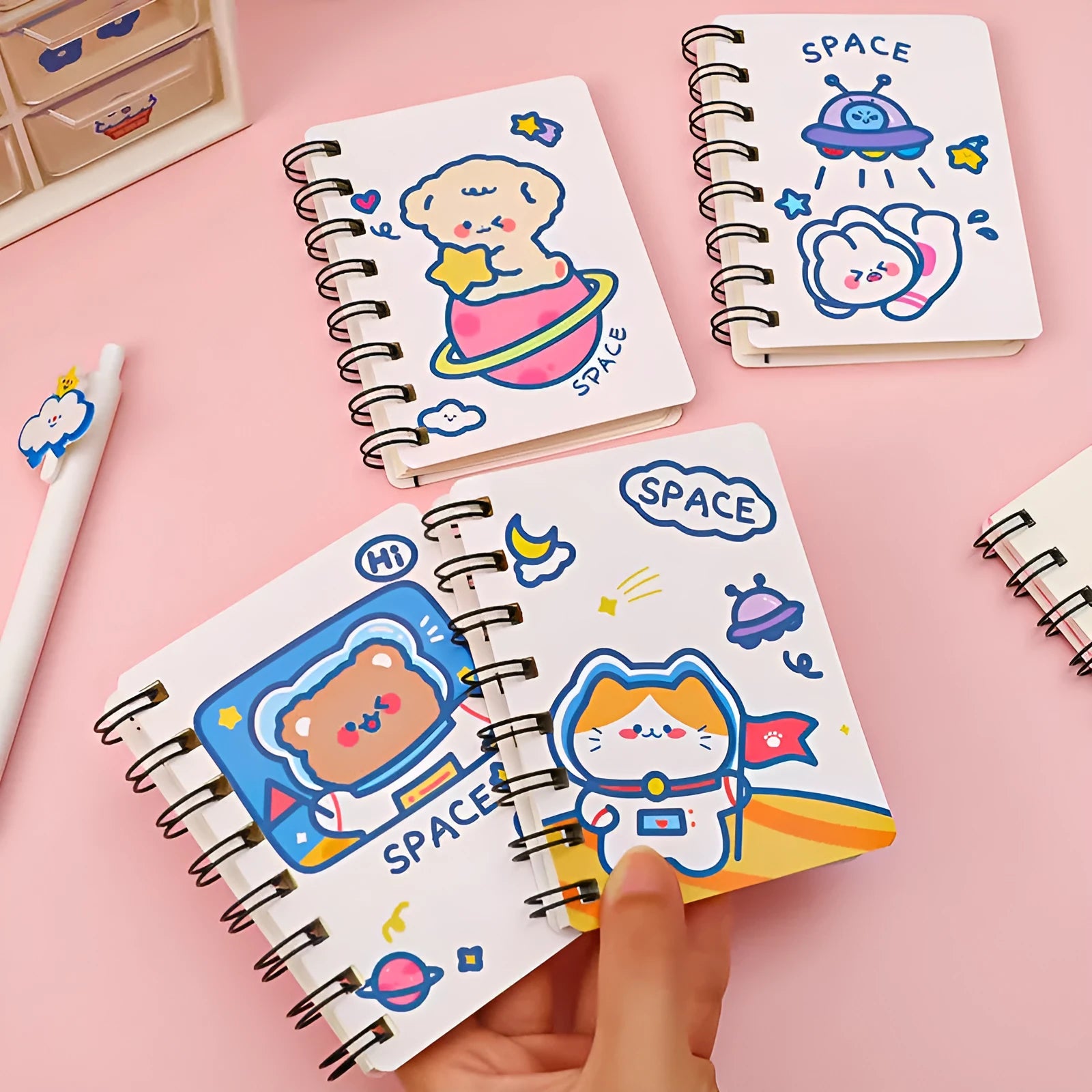 Compact astronaut series flip notebook with space-themed cover, shown closed.