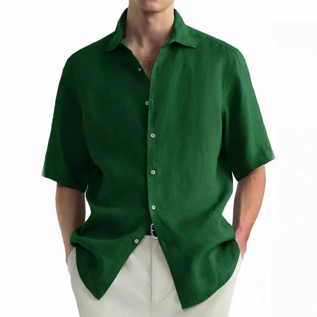 Men's green washed cotton casual shirt in a regular fit cardigan style on a hanger.