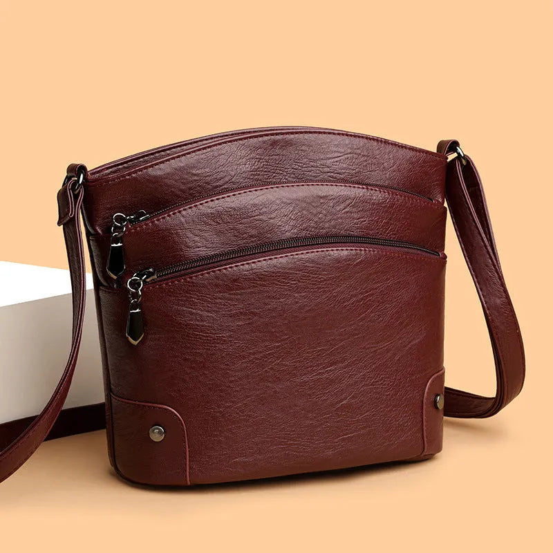 Large capacity PU bucket bag for women in black with multi-layer internal pockets and outer slit pocket