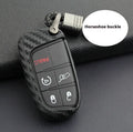 Black silicone key case for Dodge Chrysler Fiat remote, shown with and without a large plastic attachment buckle.