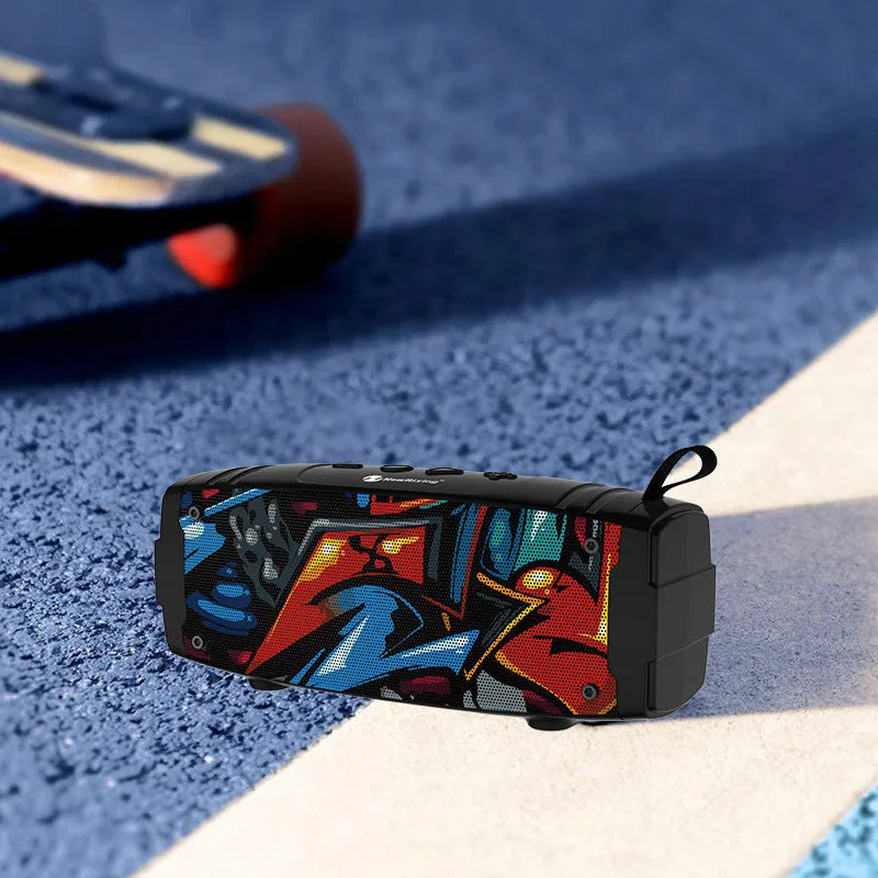 Portable wireless Bluetooth speaker with multiple colour options including black, blue, and camouflage.