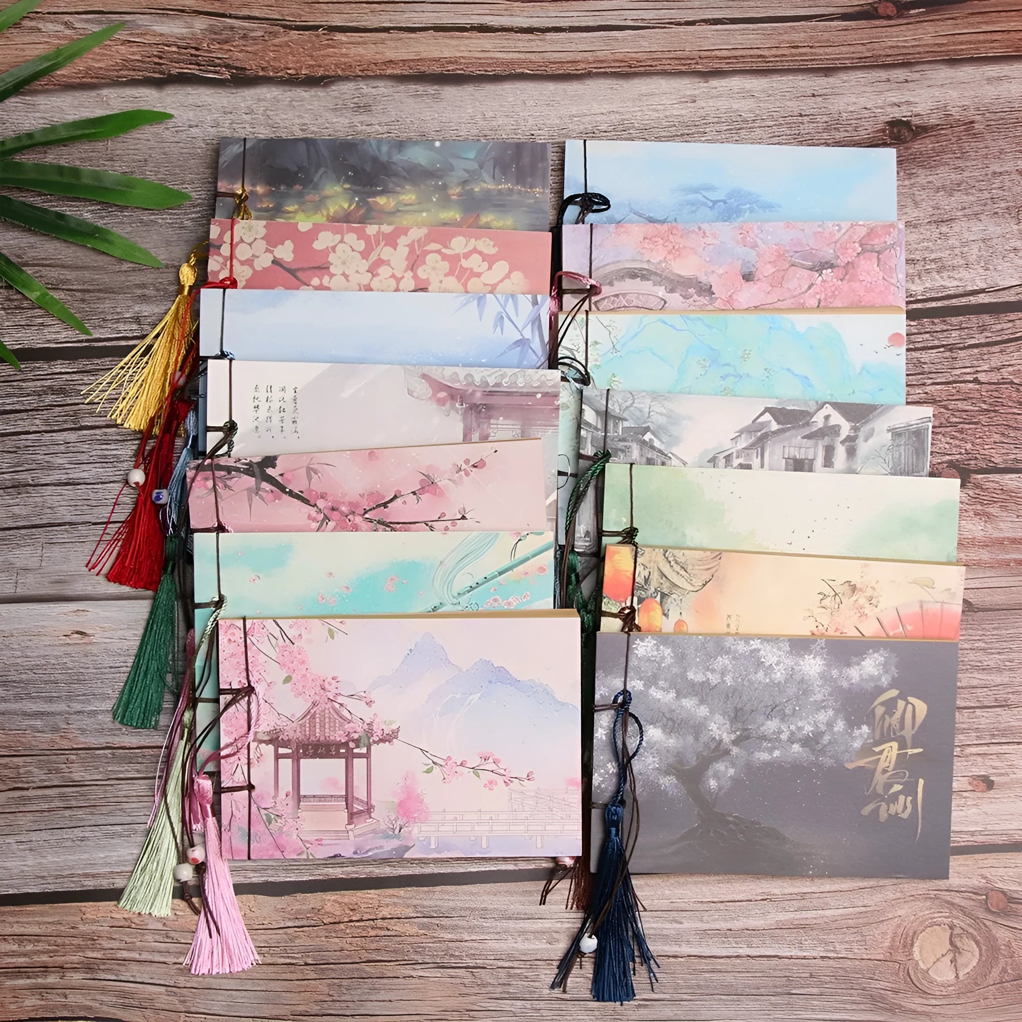 Kraft paper notebook with tassel and hand-stitched binding in various colours, showing 12 x 14.5 cm size.