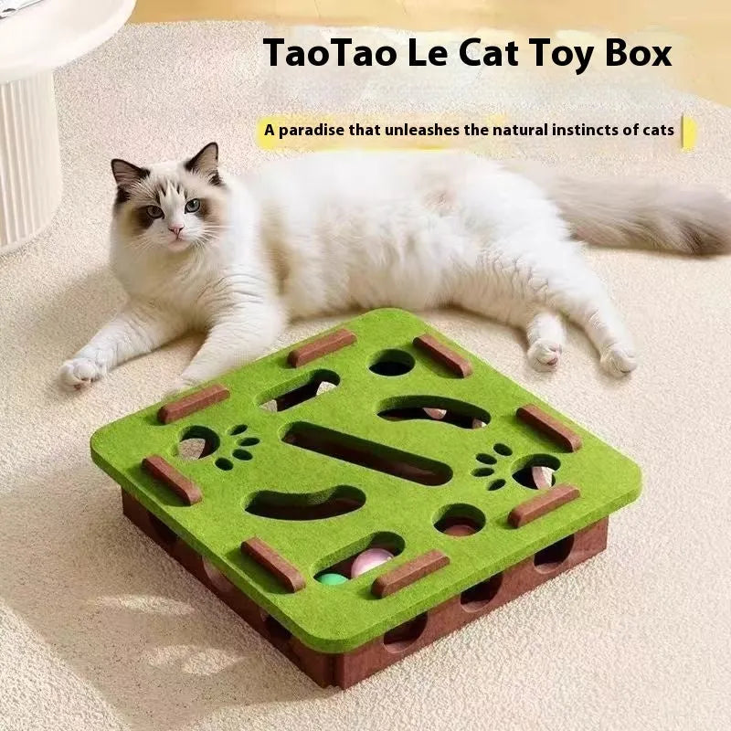 Green brown felt cat toy box with a square hole, measuring 30 cm, on a wooden floor.