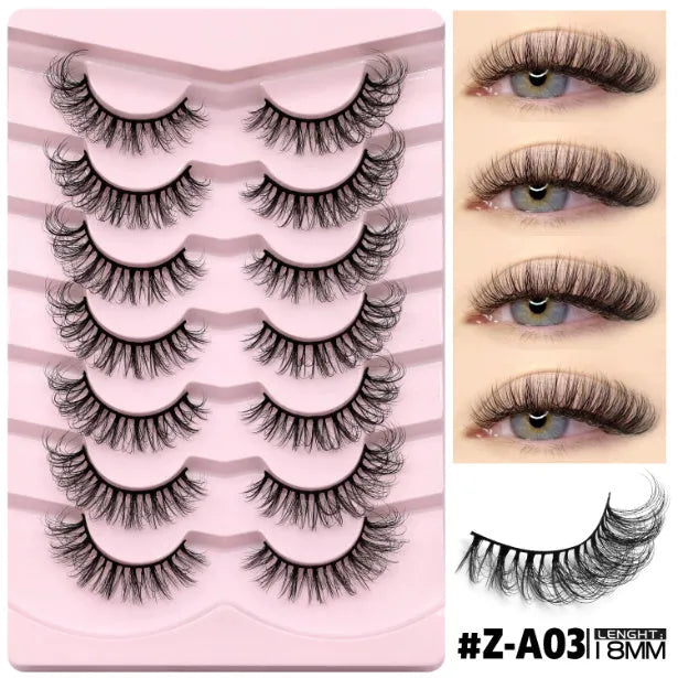 Box of artificial fibre false eyelashes in a natural long thick style with adhesive glue.