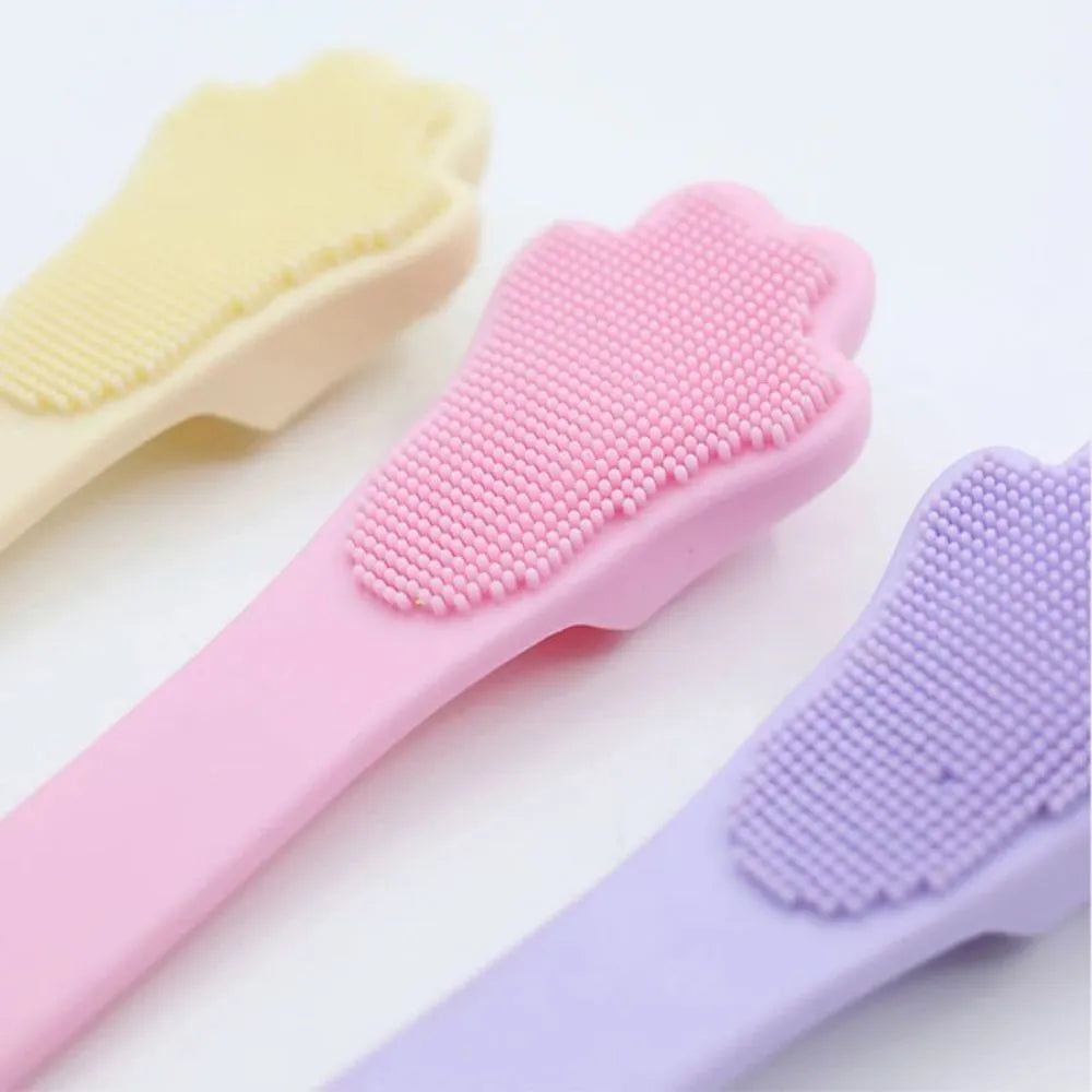 Silicone finger toothbrush for pets in pink, purple, and yellow colours