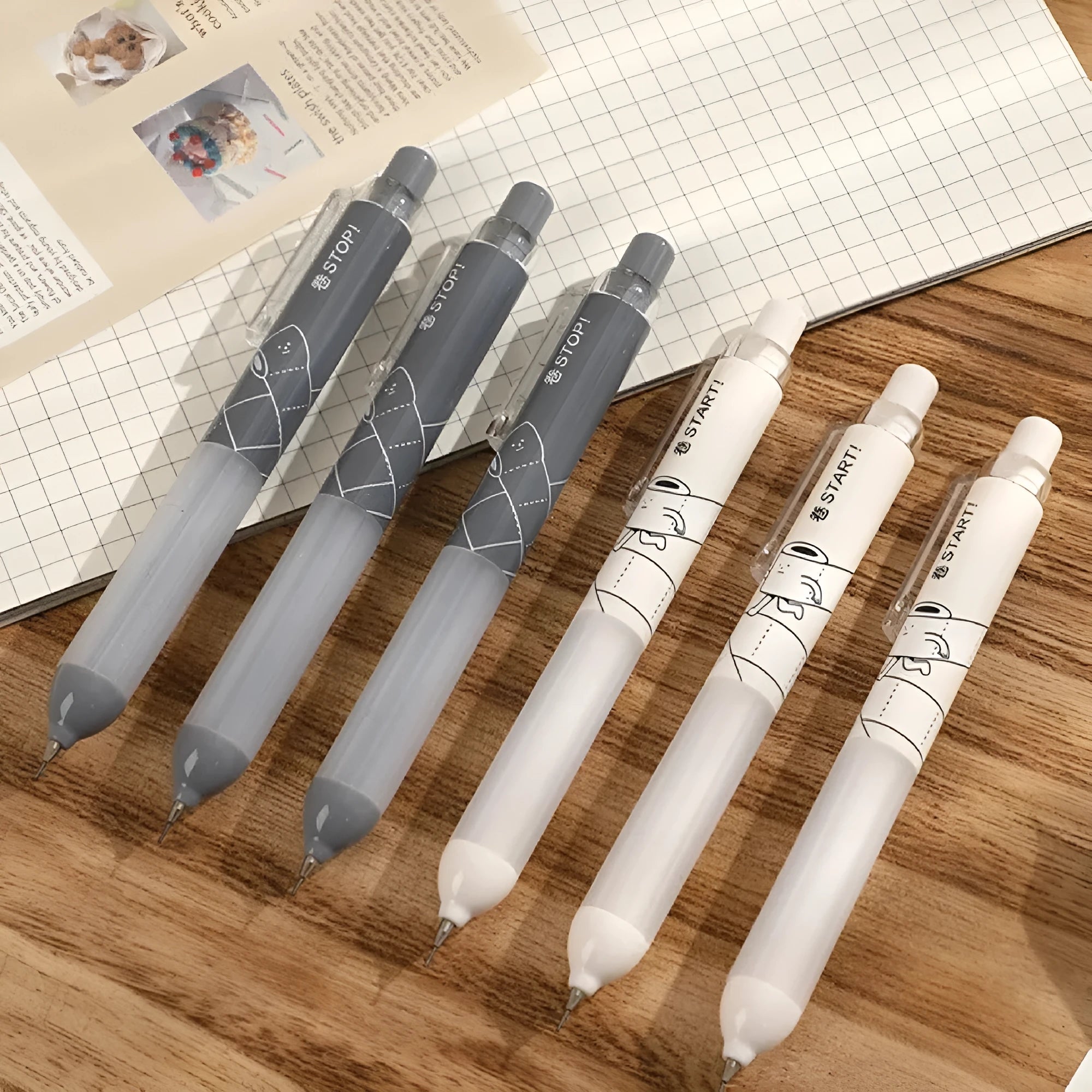 Black and white 0.5mm mechanical pencils with a soft cloud grip on the holder.
