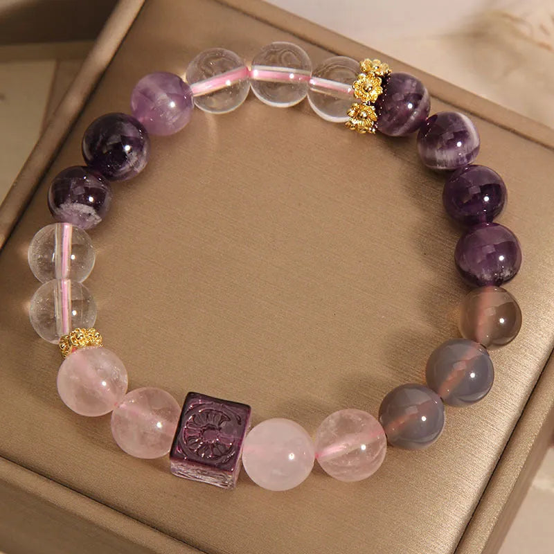 Purple women's bracelet with natural amethyst stones and rhinestones on a 10mm wide crystal band.