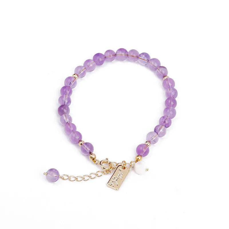 Women's natural crystal bracelet with lavender amethyst stones and animal zodiac design