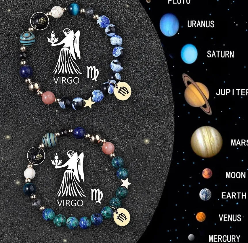 Two natural stone beaded bracelets with sterling silver zodiac charms on a wooden surface.